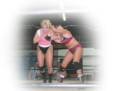 Ms. Divine preparing to toss Maria to the mat.